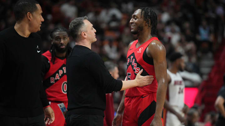 Apr 12, 2024; Miami, Florida, USA;  Toronto Raptors head coach Darko Rajakovic shares a laugh with guard Immanuel Quickley (5) during the second half against the Miami Heat at Kaseya Center. Mandatory Credit: Jim Rassol-USA TODAY Sports