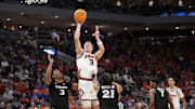 Mar 21, 2025; Milwaukee, WI, USA: Illinois Fighting Illini forward Ben Humrichous (3) shoots a layup past Xavier Musketeers guard Dailyn Swain (3) at Fiserv Forum. Mandatory Credit: Jeff Hanisch-Imagn Images