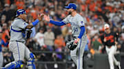 Royals pitcher Lucas Erceg is congratulated by catcher Salvador Perez after getting the last out in Kansas City's series-clinching win