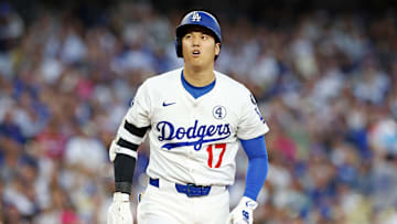 Jun 2, 2025; Los Angeles, California, USA; Los Angeles Dodgers two-way player Shohei Ohtani (17) reacts after a hit during the third inning against the New York Mets during the third inning against the New York Mets at Dodger Stadium. Mandatory Credit: Jason Parkhurst-Imagn Images