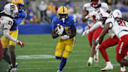 Oct 25, 2025; Pittsburgh, Pennsylvania, USA;  Pittsburgh Panthers running back Ja'Kyrian Turner (25) carries the ball against the North Carolina State Wolfpack during the third quarter at Acrisure Stadium. Mandatory Credit: Charles LeClaire-Imagn Images