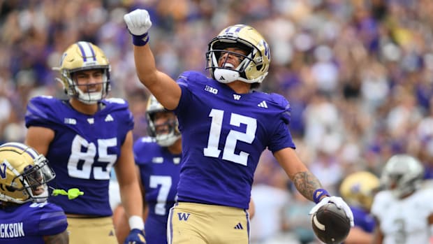 Denzel Boston (12) caught two touchdown passes against Eastern Michigan on Saturday at Husky Stadium. 