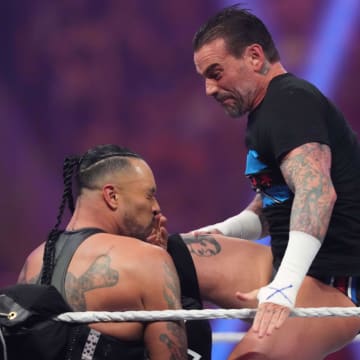 Jan 27, 2024; St. Petersburg, FL, USA; CM Punk attacks Damian Priest during the Men's Royal Rumble match at Tropicana Field.