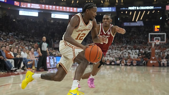 Mar 8, 2025; Austin, Texas, USA; Texas Longhorns guard Tramon Mark (12) drives past Oklahoma Sooners forward Jalon Moore (14) during the first half at Moody Center.