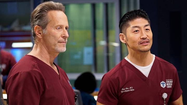 CHICAGO MED -- "Fathers and Mothers, Daughters and Sons" Episode 608 -- Pictured: (l-r) Steven Weber as Dr. Dean Archer, Brian Tee as Ethan Choi