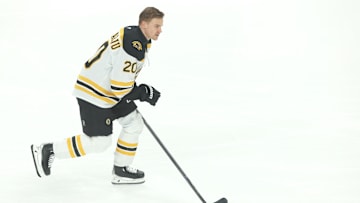 Apr 13, 2025; Pittsburgh, Pennsylvania, USA;  Boston Bruins defenseman Henri Jokiharju (20) warms up before the game against the Pittsburgh Penguins at PPG Paints Arena. Mandatory Credit: Charles LeClaire-Imagn Images