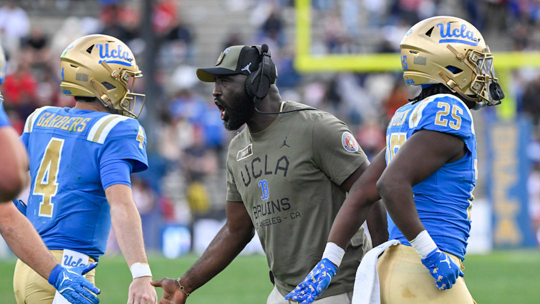 Nov 30, 2024; Pasadena, California, USA; UCLA Bruins head coach DeShaun Foster greets quarterback Ethan Garbers (4) during the third quarter against the Fresno State Bulldogs at Rose Bowl. Mandatory Credit: Robert Hanashiro-Imagn Images