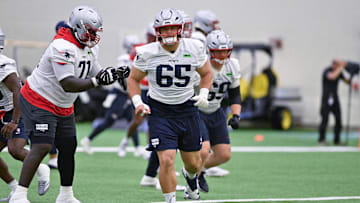 Jun 10, 2025; Foxborough, MA, USA; New England Patriots center Garrett Bradbury (65) does a drill during minicamp held in the WIN Field House at Gillette Stadium. Mandatory Credit: Eric Canha-Imagn Images