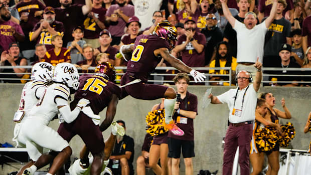 Arizona State Sun Devils wide receiver Jordyn Tyson (0) hurdles in the second quarter of the game 