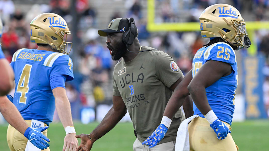 Nov 30, 2024; Pasadena, California, USA; UCLA Bruins head coach DeShaun Foster greets quarterback Ethan Garbers (4) during the third quarter against the Fresno State Bulldogs at Rose Bowl. Mandatory Credit: Robert Hanashiro-Imagn Images