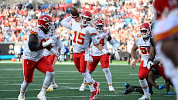Nov 24, 2024; Charlotte, North Carolina, USA; Kansas City Chiefs quarterback Patrick Mahomes (15) throws a touchdown pass in the third quarter at Bank of America Stadium. Mandatory Credit: Bob Donnan-Imagn Images