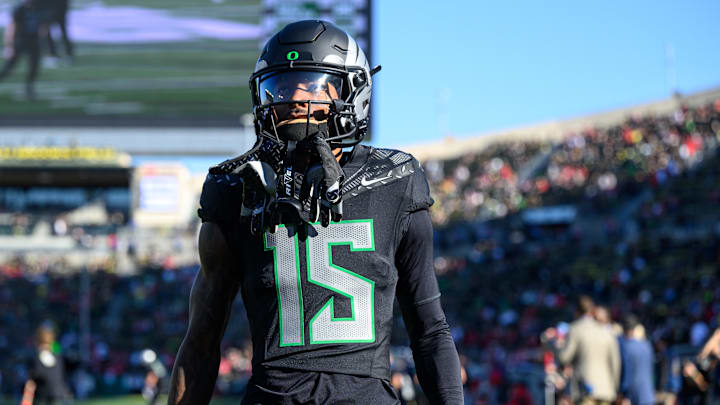 Oregon Ducks wide receiver Tez Johnson warms up before the game against the Ohio State Buckeyes at Autzen Stadium. Oregon Ducks wide receiver Tez Johnson warms up before the game against the Ohio State Buckeyes at Autzen Stadium.