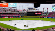 The tarp covers the infield during a rain delay before the MLB interleague game between the Cincinnati Reds and the Chicago White Sox at Great American Ball Park in Cincinnati on Tuesday, May 13, 2025.