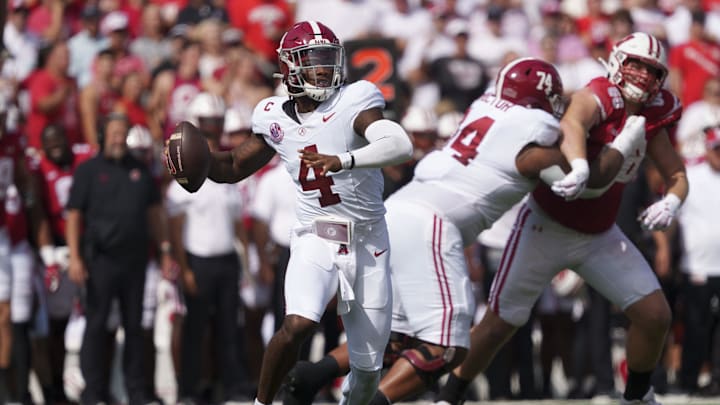 Sep 14, 2024; Madison, Wisconsin, USA;  Alabama Crimson Tide quarterback Jalen Milroe (4) throws a pass during the first quarter against the Wisconsin Badgers at Camp Randall Stadium. Mandatory Credit: Jeff Hanisch-Imagn Images