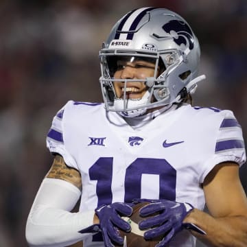 Nov 18, 2023; Lawrence, Kansas, USA; Kansas State Wildcats wide receiver Keagan Johnson (10) scores a touchdown during the first half against the Kansas State Wildcats at David Booth Kansas Memorial Stadium. Mandatory Credit: Jay Biggerstaff-USA TODAY Sports