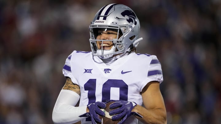 Nov 18, 2023; Lawrence, Kansas, USA; Kansas State Wildcats wide receiver Keagan Johnson (10) scores a touchdown during the first half against the Kansas State Wildcats at David Booth Kansas Memorial Stadium. Mandatory Credit: Jay Biggerstaff-USA TODAY Sports