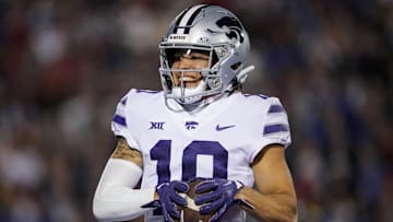 Nov 18, 2023; Lawrence, Kansas, USA; Kansas State Wildcats wide receiver Keagan Johnson (10) scores a touchdown during the first half against the Kansas State Wildcats at David Booth Kansas Memorial Stadium. Mandatory Credit: Jay Biggerstaff-Imagn Images