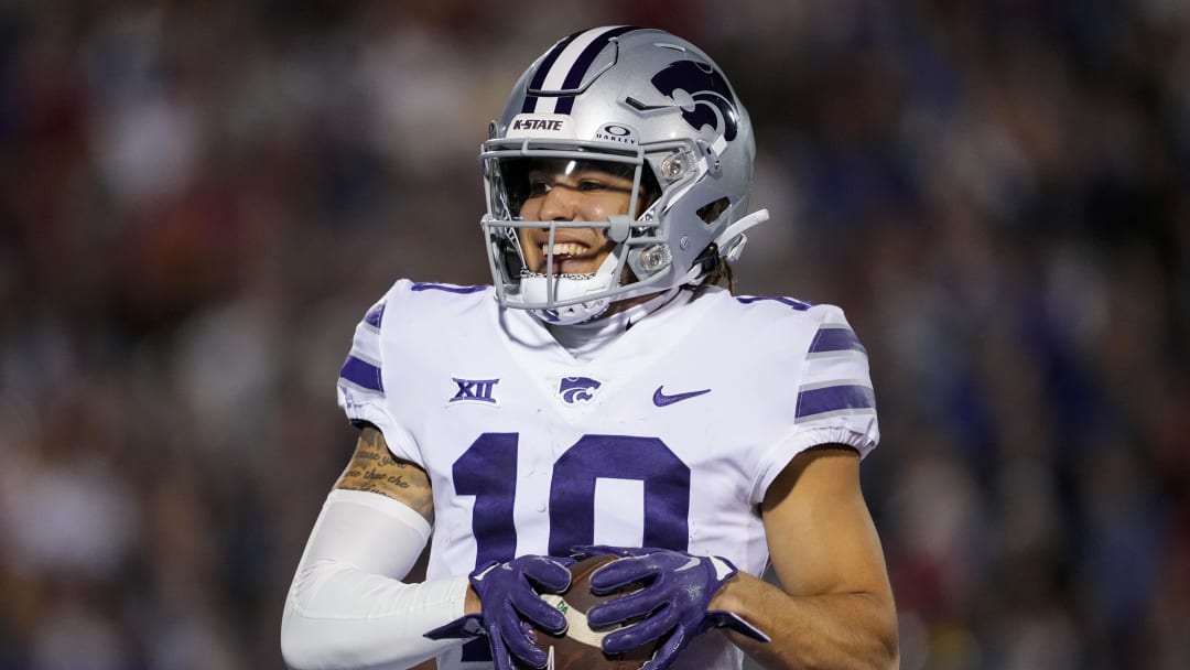 Nov 18, 2023; Lawrence, Kansas, USA; Kansas State Wildcats wide receiver Keagan Johnson (10) scores a touchdown during the first half against the Kansas State Wildcats at David Booth Kansas Memorial Stadium. Mandatory Credit: Jay Biggerstaff-USA TODAY Sports