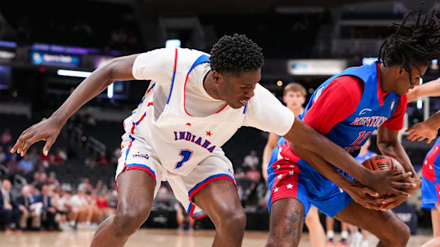 Indiana All-Star Flory Bidunga (1) reaches for the ball against Kentucky All-Star Dayton Williams (12) on Saturday, June 8, 2