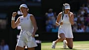 Iga Swiatek (On) Amanda Anisiomova (Nike) wear white at Wimbledon.