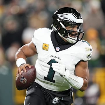 Nov 10, 2025; Green Bay, Wisconsin, USA; Philadelphia Eagles quarterback Jalen Hurts (1) rolled out against the Green Bay Packers in the first half at Lambeau Field. 