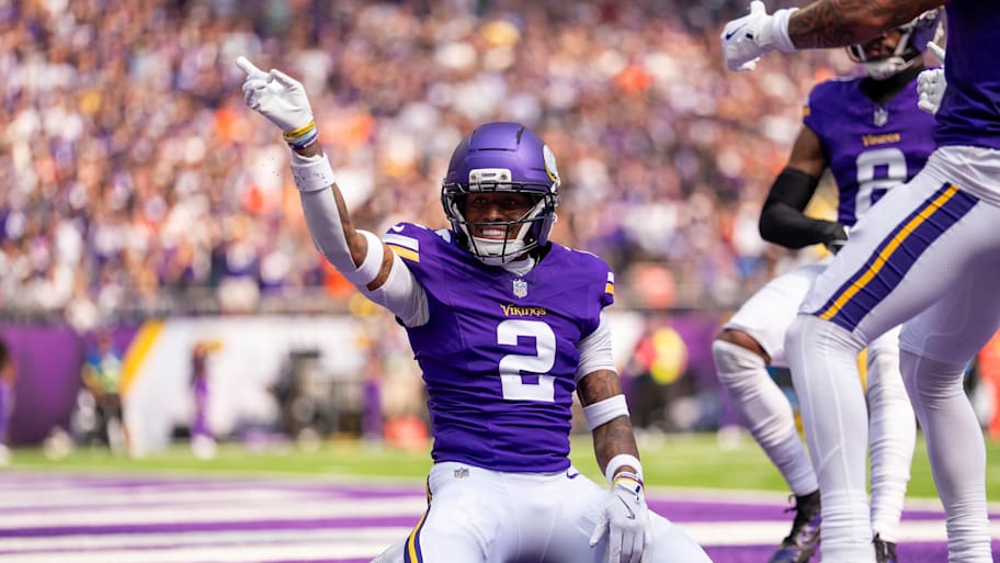 Isaiah Rodgers kneels and points in theend zone