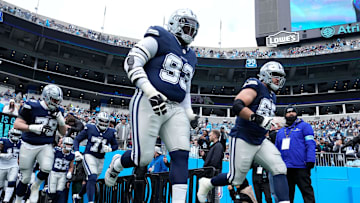 Dec 15, 2024; Charlotte, North Carolina, USA;  Dallas Cowboys including defensive tackle Linval Joseph (93) and offensive tackle Dakoda Shepley (65) run on to the field before the game at Bank of America Stadium.
