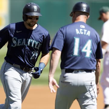 Seattle Mariners catcher Cal Raleigh (29) is congratulated after hitting a home run against the Oakland Athletics on Thursday at Oakland Coliseum.