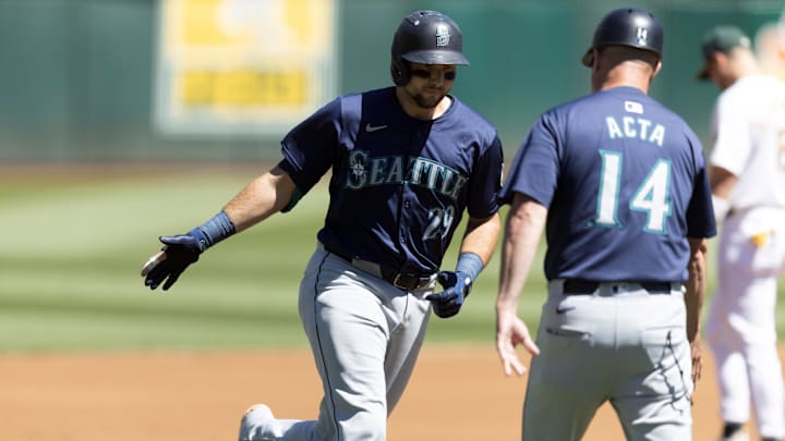 Seattle Mariners catcher Cal Raleigh (29) is congratulated after hitting a home run against the Oakland Athletics on Thursday at Oakland Coliseum.