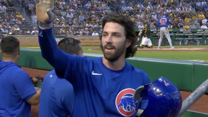 Chicago Cubs shortstop Dansby Swanson speaking to his mother in the crowd from the dugout after hitting a home run during the club's 9-5 win over the Pittsburgh Pirates at PNC Park on Tuesday, August 27, 2024. 