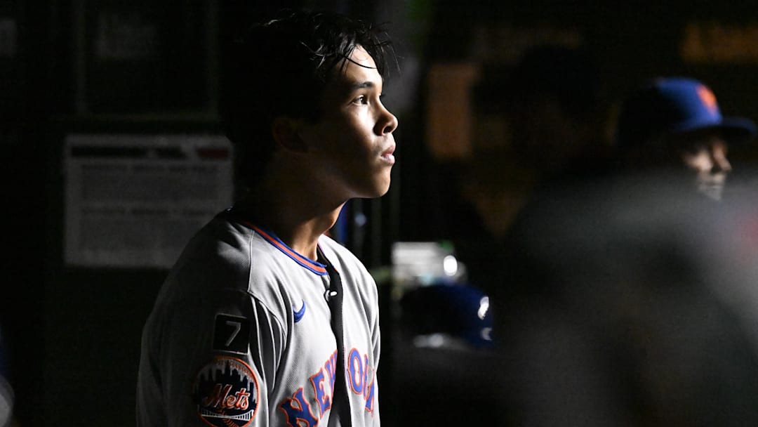 Sep 24, 2025; Chicago, Illinois, USA;  New York Mets pitcher Jonah Tong (21) sits in the dugout during the third inning against the Chicago Cubs at Wrigley Field. Mandatory Credit: Matt Marton-Imagn Images