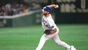 Mar 16, 2025; Bunkyo, Tokyo, Japan; Los Angeles Dodgers pitcher Matt Sauer (64) throws a pitch against the Hanshin Tigers during the fifth inning at Tokyo Dome. Mandatory Credit: Darren Yamashita-Imagn Images