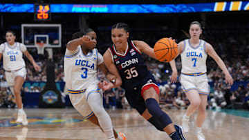 Apr 4, 2025; Tampa, FL, USA;  Connecticut Huskies guard Azzi Fudd (35) dribbles against UCLA Bruins guard Londynn Jones (3) during second quarter in a semifinal of the women's 2025 NCAA tournament at Amalie Arena. Mandatory Credit: Kirby Lee-Imagn Images