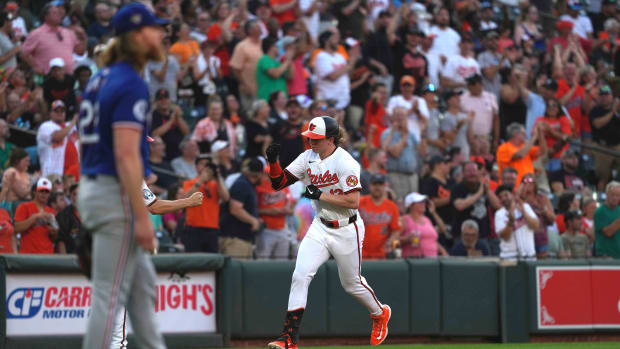 Baltimore Orioles outfielder Heston Kjerstad rounds third following his two-run homer against Texas Rangers pitcher Jon Gray.