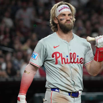 Aug 9, 2024; Phoenix, Arizona, USA; Philadelphia Phillies first base Bryce Harper (3) reacts after a high pitch in the ninth inning during a game against the Arizona Diamondbacks at Chase Field.