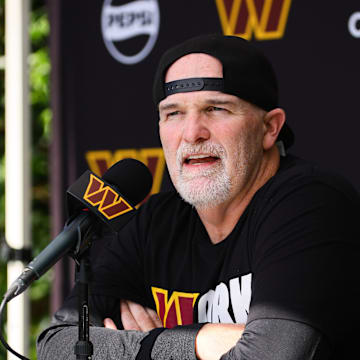 Aug 15, 2024; Miami Gardens, FL, USA;  Washington Commanders head coach Dan Quinn talks to reporters before joint practice with the Miami Dolphins at Baptist Health Training Complex. Mandatory Credit: Sam Navarro-Imagn Images