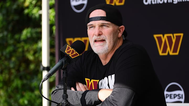 Aug 15, 2024; Miami Gardens, FL, USA;  Washington Commanders head coach Dan Quinn talks to reporters before joint practice with the Miami Dolphins at Baptist Health Training Complex. Mandatory Credit: Sam Navarro-Imagn Images