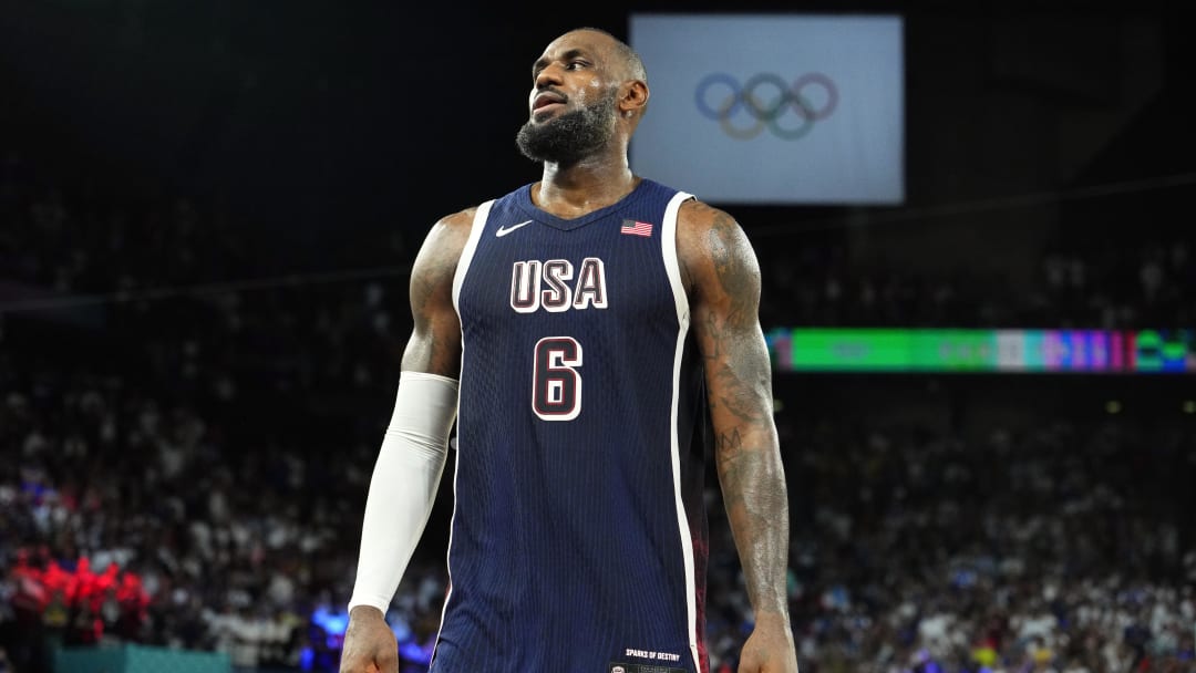 United States guard LeBron James celebrates after defeating France in the men's basketball gold medal game during the Paris 2024 Olympic Summer Games at Accor Arena.