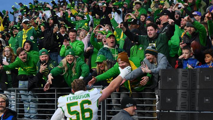 Nov 29, 2025; Seattle, Washington, USA; Oregon Ducks offensive lineman Trent Ferguson (56) celebrates with fans after the Ducks defeated the Washington Huskies at Husky Stadium. Mandatory Credit: Steven Bisig-Imagn Images