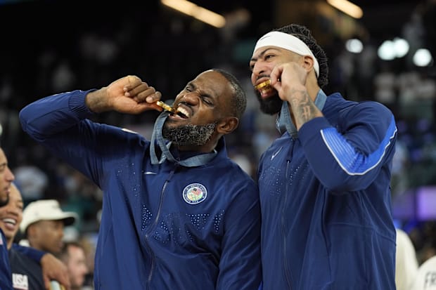 United States guard LeBron James (6) and centre Anthony Davis (14) celebrate after defeating France in the men's basketball g