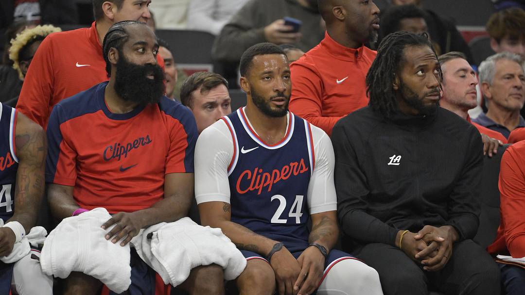 Los Angeles Clippers guard James Harden (1), guard Norman Powell (24) and forward Kawhi Leonard (2) looks on from the bench in the first half against the Portland Trail Blazers at Intuit Dome. Mandatory Credit: Jayne Kamin-Oncea-Imagn Images