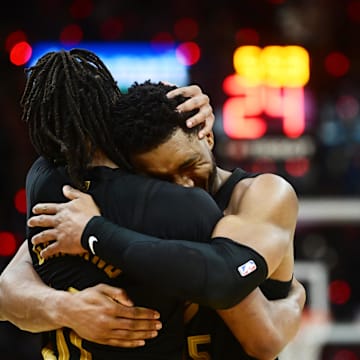 May 5, 2024; Cleveland, Ohio, USA; Cleveland Cavaliers guard Donovan Mitchell (45) celebrates with guard Darius Garland (10) after Garland hit a three point basket during the second half against the Orlando Magic in game seven of the first round for the 2024 NBA playoffs at Rocket Mortgage FieldHouse. Mandatory Credit: Ken Blaze-Imagn Images