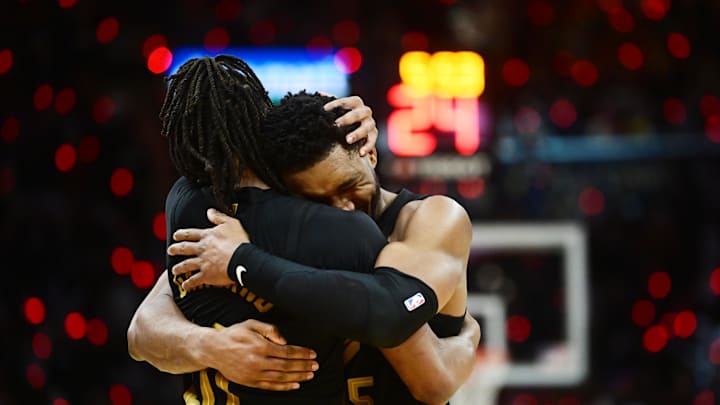 May 5, 2024; Cleveland, Ohio, USA; Cleveland Cavaliers guard Donovan Mitchell (45) celebrates with guard Darius Garland (10) after Garland hit a three point basket during the second half against the Orlando Magic in game seven of the first round for the 2024 NBA playoffs at Rocket Mortgage FieldHouse. Mandatory Credit: Ken Blaze-Imagn Images