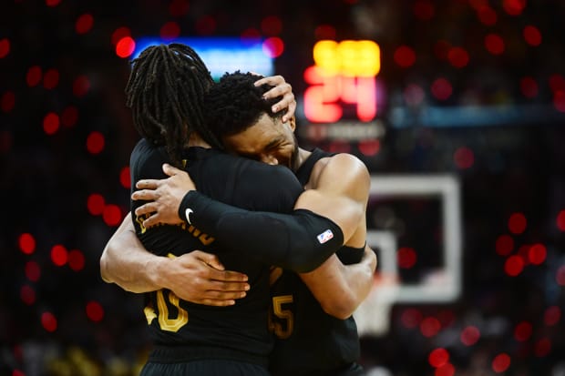  Cleveland Cavaliers guard Donovan Mitchell (45) celebrates with guard Darius Garland (10).