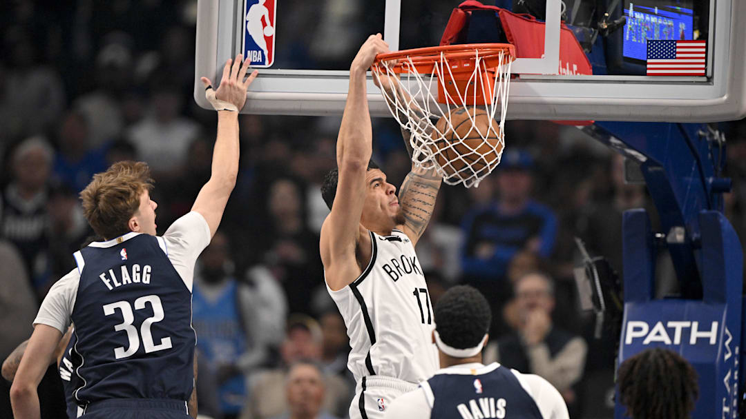 Dec 12, 2025; Dallas, Texas, USA; Brooklyn Nets forward Michael Porter Jr. (17) dunks the ball past Dallas Mavericks forward Cooper Flagg (32) and forward Anthony Davis (3) during the first quarter at the American Airlines Center. Mandatory Credit: Jerome Miron-Imagn Images Dec 12, 2025; Dallas, Texas, USA; Brooklyn Nets forward Michael Porter Jr. (17) dunks the ball past Dallas Mavericks forward Cooper Flagg (32) and forward Anthony Davis (3) during the first quarter at the American Airlines Center. Mandatory Credit: Jerome Miron-Imagn Images