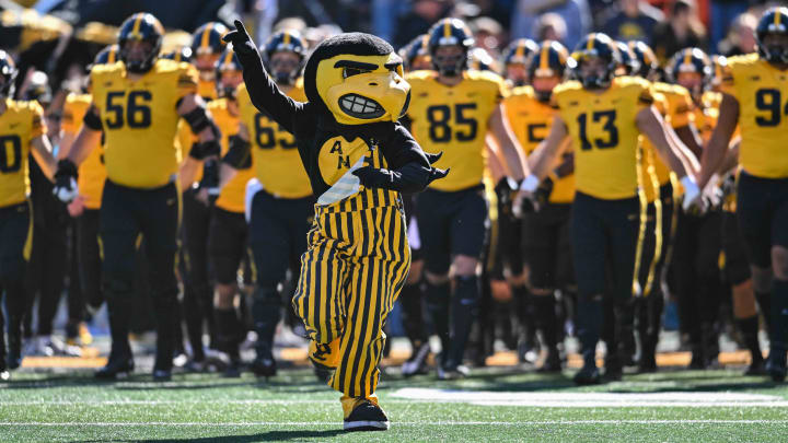 Oct 21, 2023; Iowa City, Iowa, USA; Iowa Hawkeyes Herky the Hawk leads the team onto the field during the Iowa Swarm before the game against the Minnesota Golden Gophers at Kinnick Stadium. Mandatory Credit: Jeffrey Becker-USA TODAY Sports