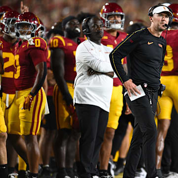 Sep 7, 2024; Los Angeles, California, USA; USC Trojans head coach Lincoln Riley reacts against the Utah State Aggies during the first quarter at United Airlines Field at Los Angeles Memorial Coliseum. Mandatory Credit: Jonathan Hui-Imagn Images