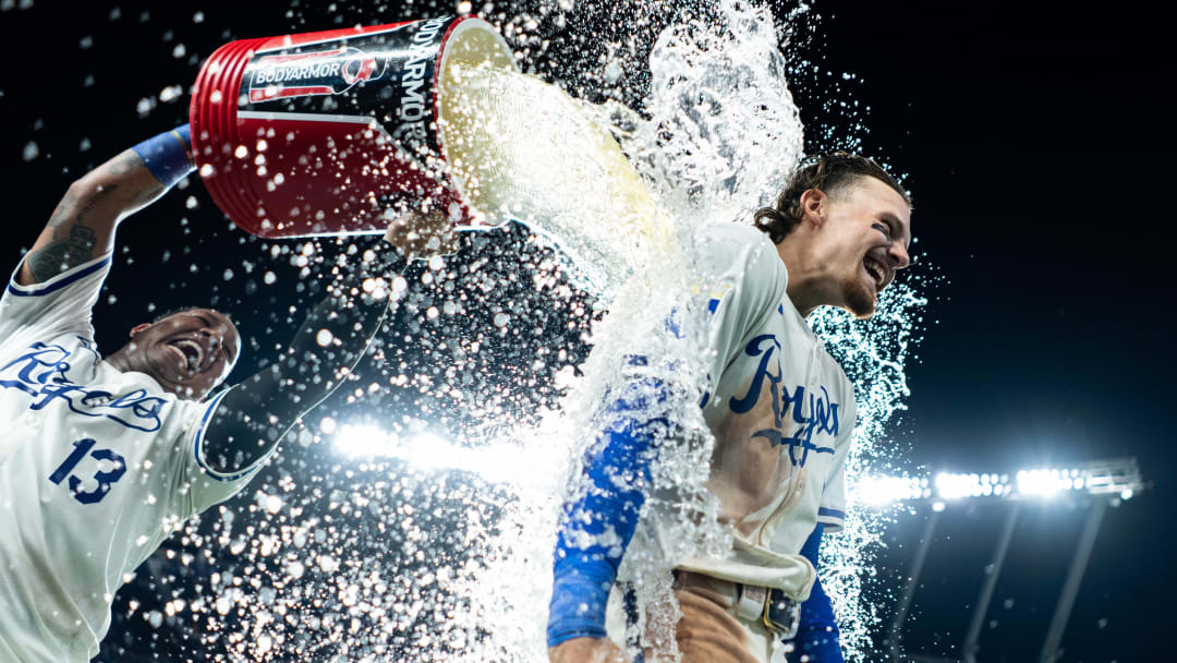 Jul 22, 2024; Kansas City, Missouri, USA; Kansas City Royals shortstop Bobby Witt Jr. (7) is doused with water by catcher Salvador Perez (13) after defeating the Arizona Diamondbacks at Kauffman Stadium. Mandatory Credit: Jay Biggerstaff-USA TODAY Sports