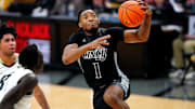 Jan 15, 2025; Boulder, Colorado, USA; Cincinnati Bearcats guard Day Day Thomas (1) shoots the ball in the first half against the Colorado Buffaloes at the CU Events Center. Mandatory Credit: Ron Chenoy-Imagn Images