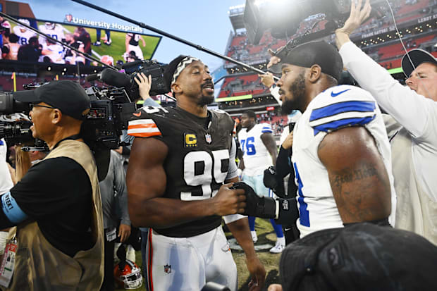Cleveland Browns defensive end Myles Garrett talks to Dallas Cowboys linebacker Micah Parsons.